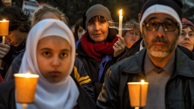 Melburnians at the Light the Dark: Melbourne says Welcome candlelight vigil for refugees at Treasury Gardens on Monday night.