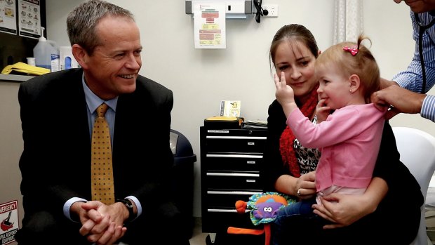 Amelia Sands, 2, tells Opposition Leader Bill Shorten her age during a visit to the Gosnells Healthcare Centre in the seat of Burt in WA together with her mother Chontelle Sands.