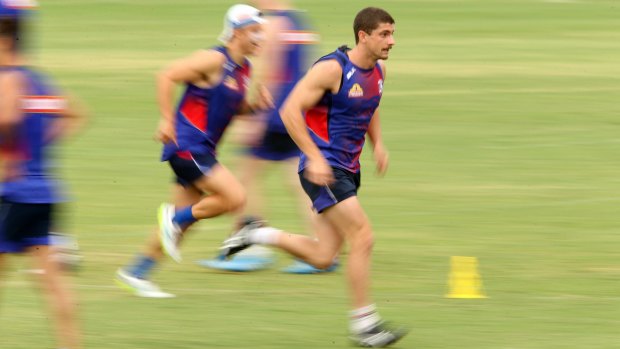 Tom Liberatore trains with team members at Whitten Oval.