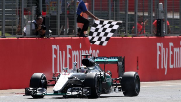 Mercedes driver Lewis Hamilton crosses the finish line to win the British Formula One Grand Prix at the Silverstone in 2016. 