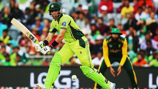 Average total: Misbah ul Haq of Pakistan works the ball away for a single.