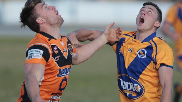 NSW or country? Helensburgh's Wayne Bremner and Dapto's Jake Harrigan wait for the ball in an Illawarra Coal League match.