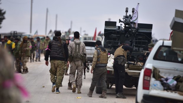 Members of Free Syrian Army advance towards al-Bab, Aleppo, on Thursday.