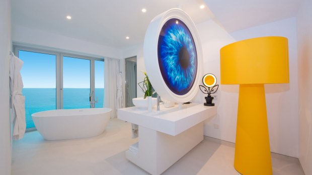The centrepiece of the large bathrooms is a big round mirror backed by a big blue eyeball. Iberostar Grand Hotel Portals Nous, Mallorca.