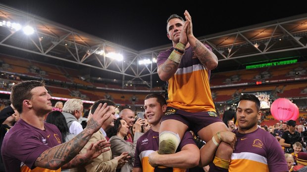 Broncos skipper Corey Parker carried off by his teammates after the end of the competition games, before the 2016 finals season began.