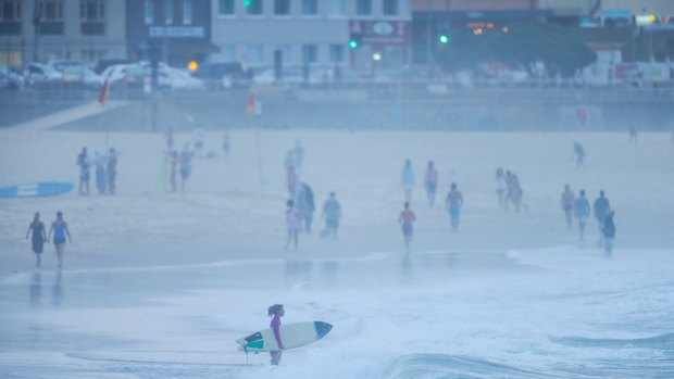 Crowds enjoy Bondi Beach at first light on Friday, during Sydney's long, hot spell.
