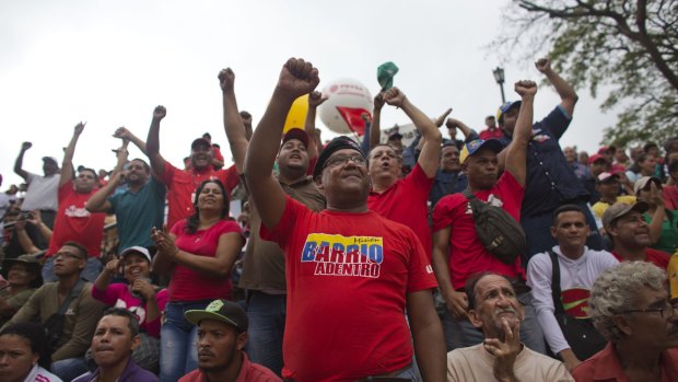 Supporters of President Nicolas Maduro marched to protest an amnesty law passed by the opposition-controlled congress calling for release of those it deems to be political detainees, on Thursday.