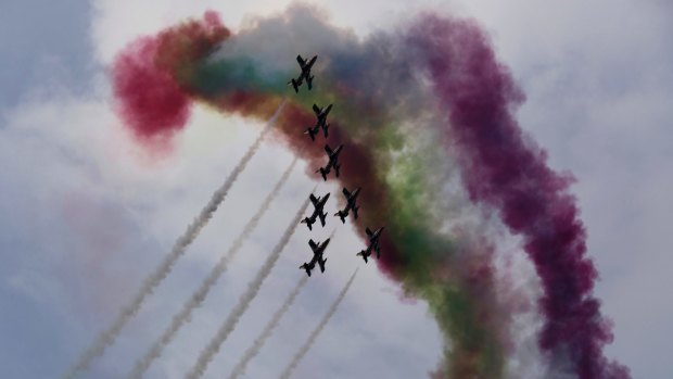 Military stunt pilots fly in formation during an exercise in Abu Dhabi.