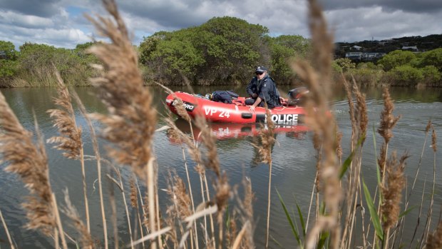 Police search the Paincalak Creek in boat at Aireys inlet.