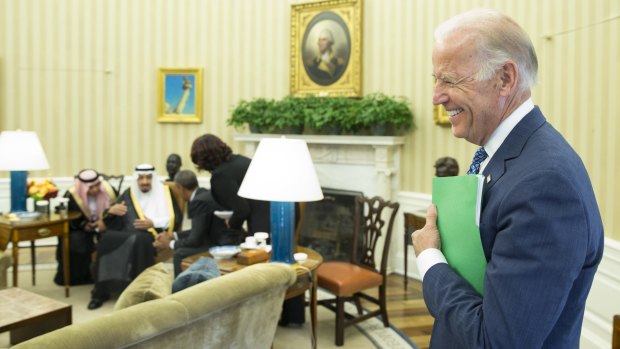 Vice President Joe Biden stands in the Oval Office during a meeting between Barack Obama and King Salman.