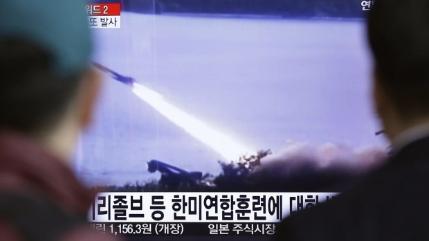 South Koreans view television footage of a North Korean missile launch in March. 