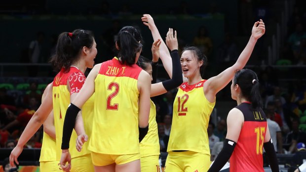 One more needed: China celebrate winning the third set.