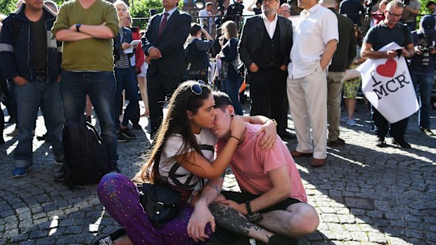 Members of the public gather in Albert Square, Manchester on Tuesday afternoon.