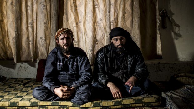 Hassan Aboud, left, with Abu Ayman in Sarmin, Syria, in 2013, when Aboud was leading attacks against Syrian army positions that were shelling the nearby civilian population nearby.