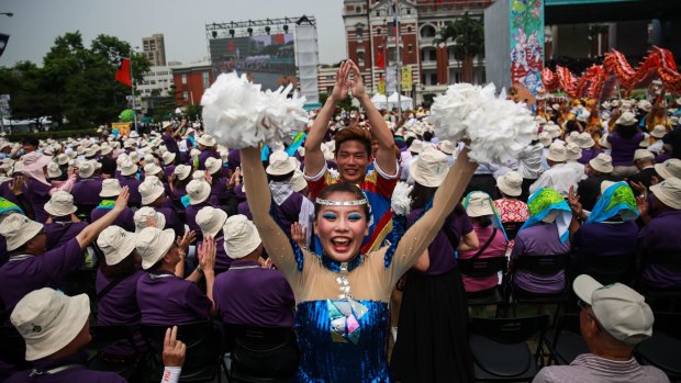Performers walk past attendees during Tsai Ing-wen's inauguration ceremony on Friday.