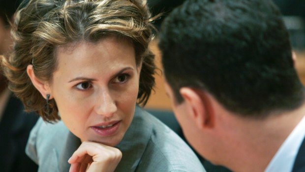Syrian President Bashar al-Assad, right, listens to his wife Asma Assad during a visit to India in 2008.