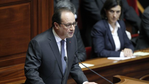 French President Francois Hollande delivers a speech during an exceptional joint gathering of both houses of parliament on Tuesday evening .