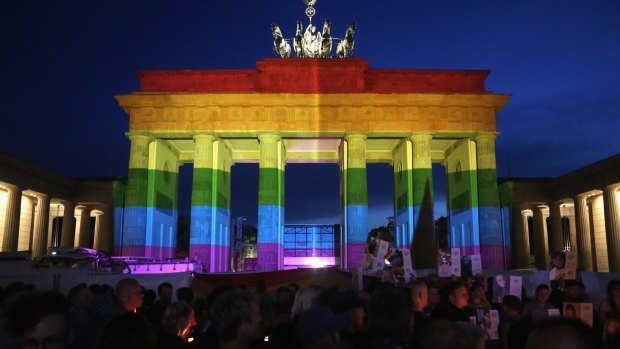 The Brandenburg Gate in Germany is seen with a rainbow flag projected onto it during a vigil for victims of the Orlando, Florida nightclub shooting. 
