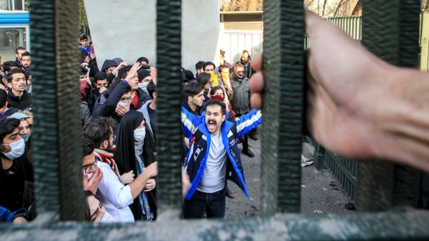 University students attend an anti-government protest inside Tehran University on  December 30.