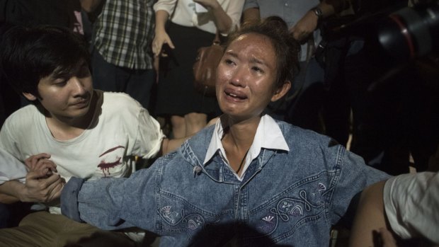 A student cries during an anti junta demonstration as Thai Police wait to clear the area on May 22, 2015.