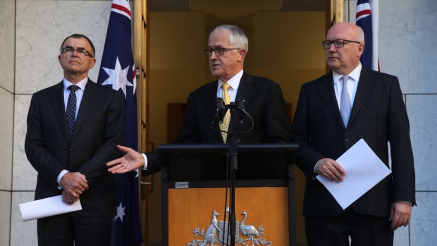 Prime Minister Malcolm Turnbull and Attorney-General George Brandis at last week's announcement naming Brian Martin as the commissioner.