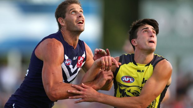 Fremantle's Aaron Sandilands and Tiger Ivan Soldo contest the ruck during their NAB Challenge match. 