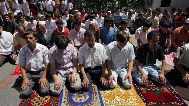 Uighur men pray in a mosque in Urumqi, the capital of western China's Xinjiang province. 