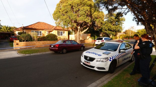 Police outside the Tamvakis family home in Bentleigh last year.