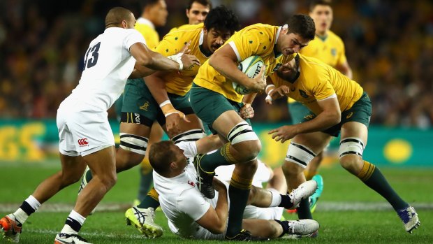 Rounded up: Wallabies forward Rob Simmons is tackled during the Test between Australia and England at Allianz Stadium.