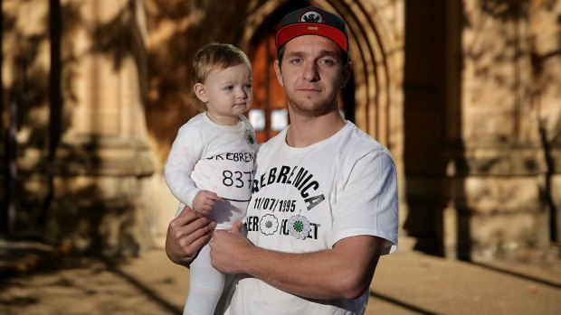 Fairfield painter Dzevad Smajic, who was orphaned by the Srebrenica slaughter, with his daughter Amra at Sydney Town Hall on Saturday. 