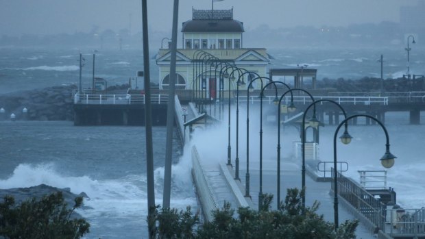 Wild windy weather hits St Kilda Beach on Monday morning.