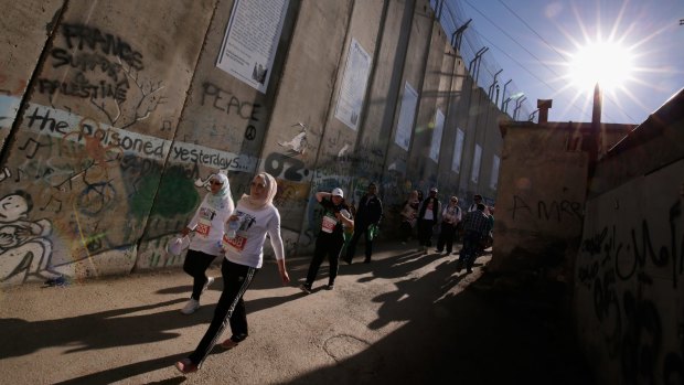 The Palestine Marathon's route alongside the Israeli-built separation wall near the occupied West Bank city of Bethlehem on April 1.