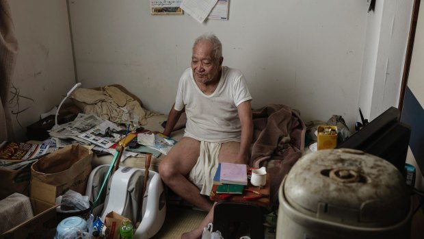 Yoshikazu Kinoshita, 83, in his apartment, in which he has lived for 14 years.