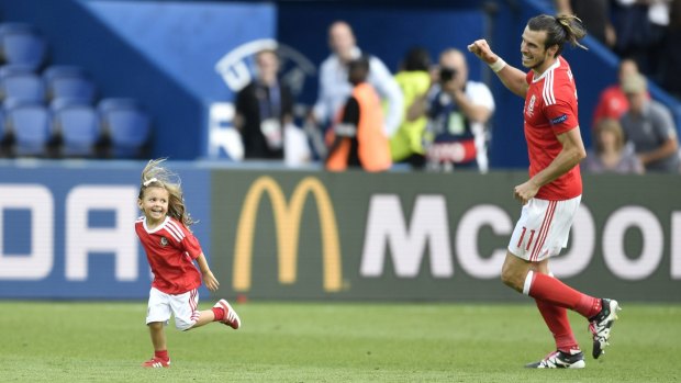 Dayyd-daughter day: Welsh star Gareth Bale celebrates with his daughter Alba after winning the Euro 2016 round of 16 match over Northern Ireland.