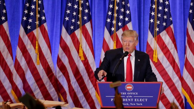 President-elect Donald Trump takes questions from members of the media during a news conference.