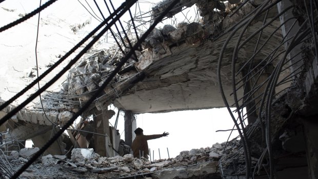 The aftermath of an airstrike that killed seven people in Sanaa, Yemen,  in September 2015.