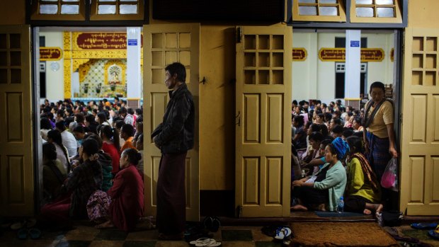 Followers of Ashin Wirathu, an ultra-nationalist Buddhist monk, watch him deliver a sermon in June 2013. Public opinion among Myanmar's Burmese majority runs strongly against recognising Rohingya rights.