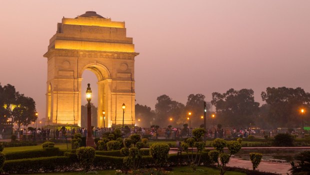 India Gate illuminated at twilight.