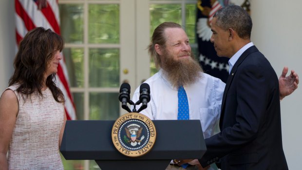 Bowe Bergdahl's parents Jani and Bob are congratulated by US President Barack Obama in the White House Rose Garden after he announced the deal to secure their son's freedom in May 2014.