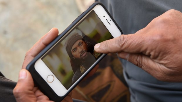 Yusuf Abbas points to a photo of Neil Prakash identifying him as the foreign fighter he saw in a Mosul market with bodyguards and an interpreter.