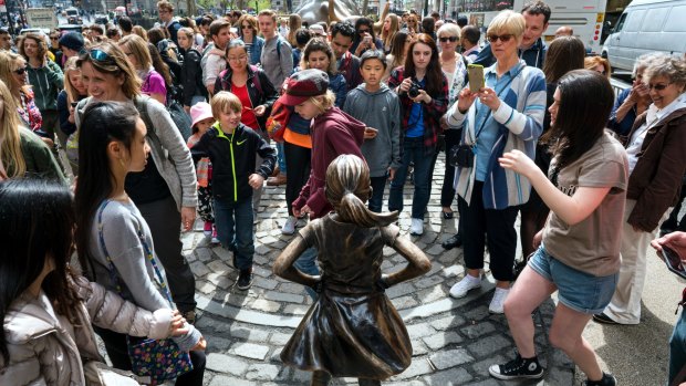 Fearless Girl is popular with crowds - especially young women. 