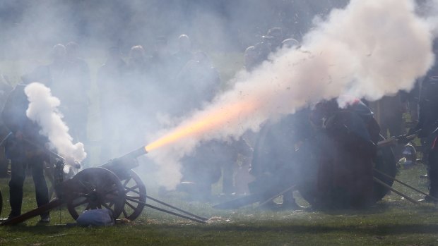 A 21-gun salute is fired near a coffin carrying the remains of Richard III near Leicester. 