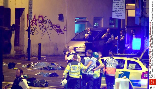 Police at the scene of the crash in Finsbury Park, north London, in which a van ploughed into a group of people.