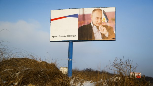 A billboard with a portrait of Russian President Vladimir Putin on the road outside Simferopol, Crimea, earlier this year.