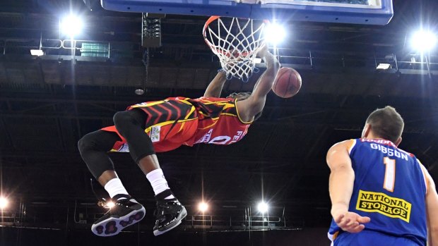 Carrick Felix dunks for United as they beat Brisbane on their own turf.