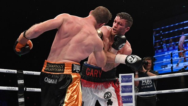 Brutal encounter: Horn and Corcoran trade shots in what became a bloody war in the middle rounds.