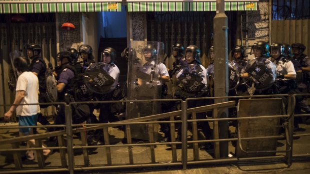 Riot police during a protest in Hong Kong opposing an expected decision by China to reinterpret the city's law in a way that explicitly bans pro-independence activists from the legislature.
