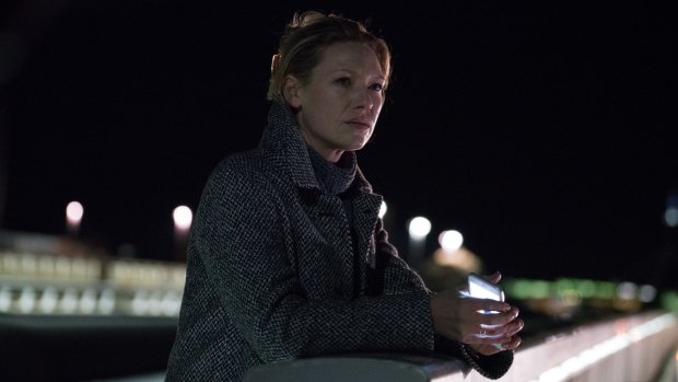 Anna Torv as journalist Harriet Dunkley on Commonwealth Avenue Bridge in the new series 