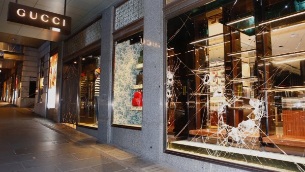 Thieves used sedgehammers to smash their way into the Gucci handbags store on Collins Street. 