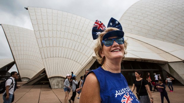A woman celebrates Australia Day by the Sydney Opera House on January 26, 2017.